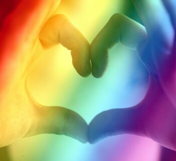 lgbtq+ colors with hands making the heart shape